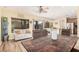 Bright dining area with laminate floors, natural light, and access to the backyard patio at 22157 W Moonlight Path, Buckeye, AZ 85326