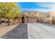 Charming two-story home with stone accents, a well-manicured lawn, and a spacious two car garage at 22157 W Moonlight Path, Buckeye, AZ 85326