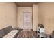 Welcoming front porch with neutral colors, a bench, decorations and a charming entrance door at 22157 W Moonlight Path, Buckeye, AZ 85326