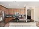Modern kitchen boasts stainless steel appliances, granite countertops, and ample cabinet space at 22157 W Moonlight Path, Buckeye, AZ 85326