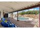 A lovely backyard has a pool and covered patio at 2230 W Peralta Ave, Mesa, AZ 85202