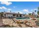 Beautiful backyard with a pool and a cozy fire pit area at 2230 W Peralta Ave, Mesa, AZ 85202