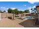 Spacious backyard with a pool, garden beds, and shade sails for outdoor enjoyment at 2230 W Peralta Ave, Mesa, AZ 85202