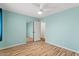 This bedroom has a mirrored closet, nice floors and a ceiling fan at 2230 W Peralta Ave, Mesa, AZ 85202