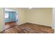 Bright bedroom features durable floors, neutral wall colors, and a sliding glass door entrance to the patio at 2230 W Peralta Ave, Mesa, AZ 85202