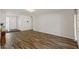 Well-lit living room with wood-style flooring, offering a welcoming entrance at 2230 W Peralta Ave, Mesa, AZ 85202
