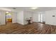 Open-concept living room with a fireplace, wood floors and plenty of natural light at 2230 W Peralta Ave, Mesa, AZ 85202