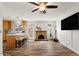 Open-concept living space featuring modern finishes and a cozy brick fireplace at 2230 W Peralta Ave, Mesa, AZ 85202