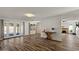 Spacious living room featuring hardwood floors, french doors, and plenty of natural light at 2230 W Peralta Ave, Mesa, AZ 85202