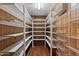 Large pantry with lots of shelving for storage at 2230 W Peralta Ave, Mesa, AZ 85202