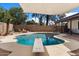 Backyard oasis featuring a pool, diving board, shade and outdoor seating at 2230 W Peralta Ave, Mesa, AZ 85202