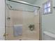 This stylish shower features a glass enclosure, tiled walls, and modern fixtures at 2230 W Peralta Ave, Mesa, AZ 85202