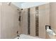 Updated shower features a modern shower head and fixtures, and decorative tile at 2230 W Peralta Ave, Mesa, AZ 85202