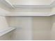 Organized walk-in closet with white shelving to maximize storage space at 2230 W Peralta Ave, Mesa, AZ 85202