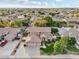 Expansive aerial shot of a home featuring lush landscaping, a pool, and a three-car garage in a well-maintained neighborhood at 22472 N 80Th Ln, Peoria, AZ 85383