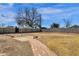 Large backyard has a brick pathway, concrete patio and block fencing for privacy and outdoor enjoyment at 2545 E Amelia Ave, Phoenix, AZ 85016