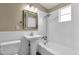 Bathroom features white subway tile, classic fixtures, and a pedestal sink for a timeless appeal at 2545 E Amelia Ave, Phoenix, AZ 85016