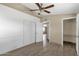 Bedroom boasts updated trim, doors, and closet, plus wood-look floors and a modern ceiling fan at 2545 E Amelia Ave, Phoenix, AZ 85016