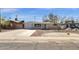 Charming single-story home with a well-maintained front yard and a long driveway at 2545 E Amelia Ave, Phoenix, AZ 85016