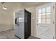 Bright kitchen with stainless steel refrigerator and white door at 2545 E Amelia Ave, Phoenix, AZ 85016