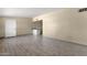 Open-concept living room featuring neutral walls, wood-look tile flooring, and a utility bar at 2545 E Amelia Ave, Phoenix, AZ 85016