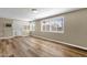 Room with wood floors, multiple windows, and mini-split air conditioner at 2545 E Amelia Ave, Phoenix, AZ 85016