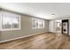 Spacious room with wood floors, closet with mirrored doors, and several windows at 2545 E Amelia Ave, Phoenix, AZ 85016