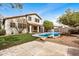 Charming backyard pool area with grassy yard and tiled patio at 2621 E Stottler Dr, Gilbert, AZ 85296