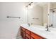 Bright bathroom featuring a dual sink vanity and a large mirror at 2621 E Stottler Dr, Gilbert, AZ 85296