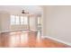 Spacious bedroom with hardwood floors, neutral walls, and ample natural light at 2621 E Stottler Dr, Gilbert, AZ 85296