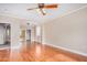 Large bedroom with hardwood floors, a ceiling fan, and neutral wall color at 2621 E Stottler Dr, Gilbert, AZ 85296