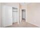 Bedroom featuring a closet with sliding doors and neutral carpet flooring at 2621 E Stottler Dr, Gilbert, AZ 85296