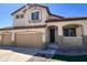 Charming two-story home with a three car garage, arched entryway, and small porch at 2621 E Stottler Dr, Gilbert, AZ 85296