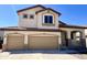 Charming two-story home with a three car garage, arched entryway, and small porch at 2621 E Stottler Dr, Gilbert, AZ 85296