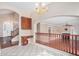 Foyer featuring ceramic tiles, a chandelier, and a glimpse into the living room and staircase at 2621 E Stottler Dr, Gilbert, AZ 85296