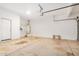 Spacious garage with water heater, providing ample room for parking and storage at 2621 E Stottler Dr, Gilbert, AZ 85296