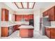 Bright kitchen with an island, stainless steel appliances, and tile floors at 2621 E Stottler Dr, Gilbert, AZ 85296