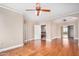 Spacious main bedroom featuring hardwood floors, a ceiling fan, and neutral walls at 2621 E Stottler Dr, Gilbert, AZ 85296