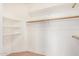 Spacious walk-in closet with ample shelving and a hanging rod for storage at 2621 E Stottler Dr, Gilbert, AZ 85296