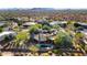 Expansive desert home featuring mature landscaping, a pool, and stunning mountain backdrop at 27903 N Agua Verde Dr, Rio Verde, AZ 85263