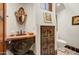 Powder room with granite countertop, unique mirror, and decorative floors at 27903 N Agua Verde Dr, Rio Verde, AZ 85263