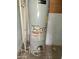 Image of an aged, tall, light gray Lochinvar water heater system at 2912 E Monroe St, Phoenix, AZ 85034