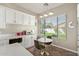 Bright breakfast nook with white cabinetry, quartz countertops, and natural light at 3344 E Grand Canyon Dr, Chandler, AZ 85249