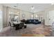 Open-concept living area with dining table, comfortable seating, and ample natural light at 3344 E Grand Canyon Dr, Chandler, AZ 85249