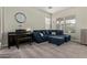 Comfortable living room with a large sofa, piano, and a neutral color palette at 3344 E Grand Canyon Dr, Chandler, AZ 85249