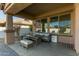 Inviting covered patio featuring stylish outdoor furniture and a charming decor for relaxing or entertaining guests at 3344 E Grand Canyon Dr, Chandler, AZ 85249
