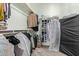Walk-in closet with built-in shelving and organized clothing racks at 3344 E Grand Canyon Dr, Chandler, AZ 85249