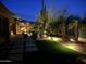 Inviting backyard with a lounge area, desert landscaping, and integrated lighting for relaxing evenings at 33705 N 64Th St, Scottsdale, AZ 85266