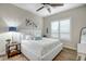 Cozy bedroom with bright natural light, a ceiling fan, and serene decor at 39705 N 3Rd St, Phoenix, AZ 85086