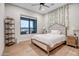 Inviting bedroom with a plush bed, large window with nice views, and elegant decor at 39705 N 3Rd St, Phoenix, AZ 85086